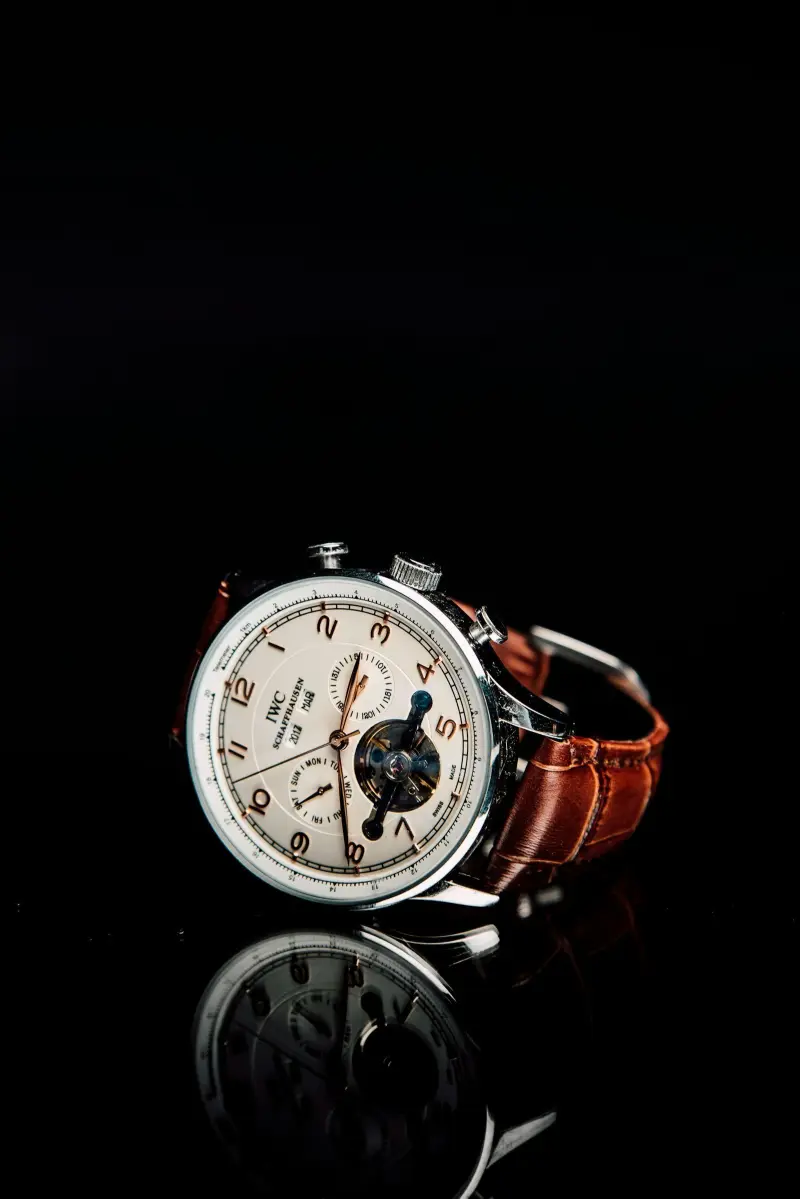A rugged dive watch next to an elegant dress watch
