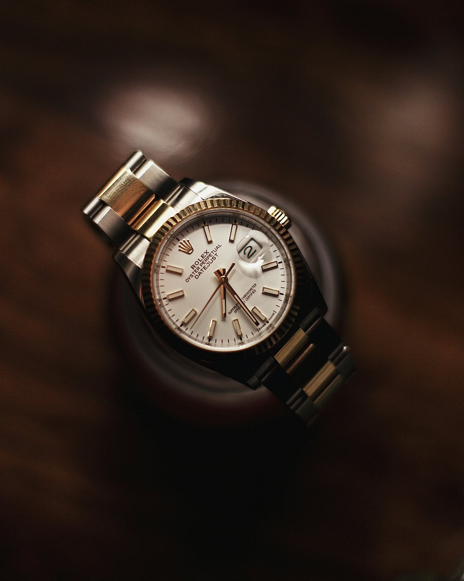 A single watch displayed on a stand